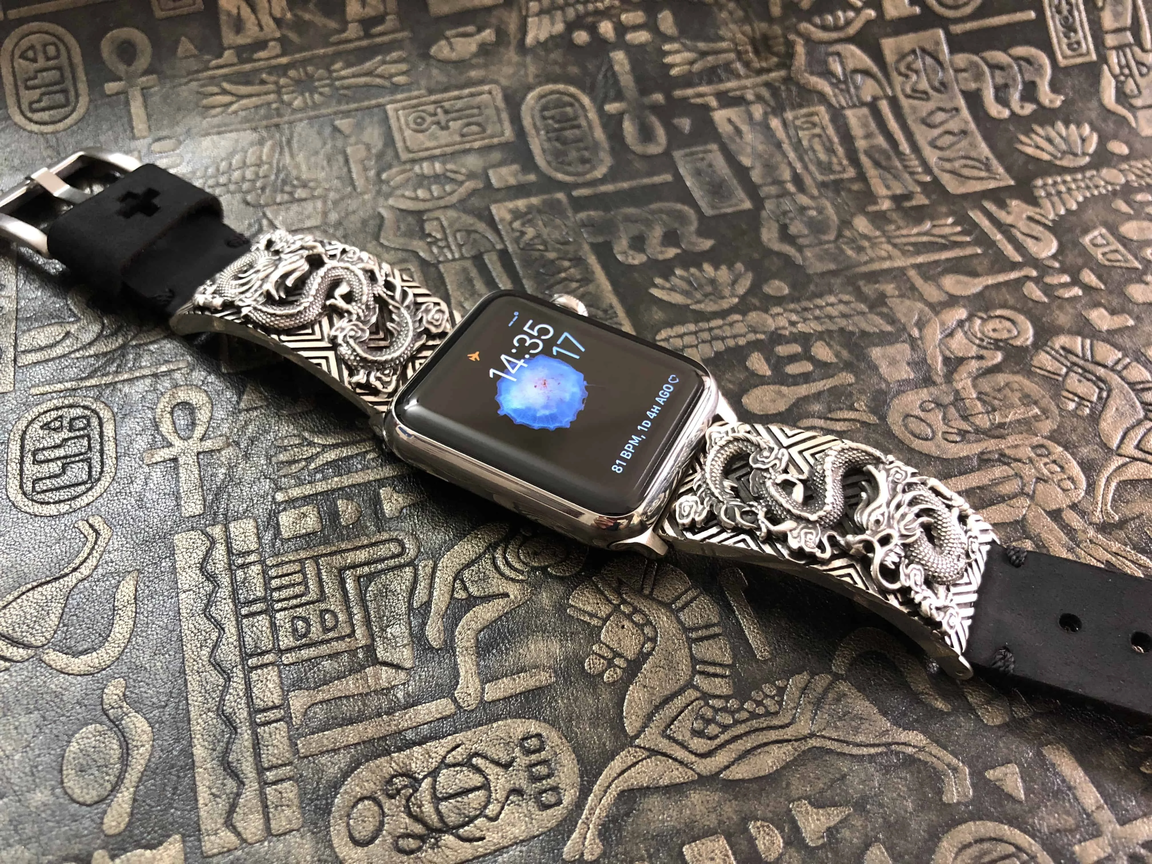 Sculpted sterling silver dragon links on an Apple Watch